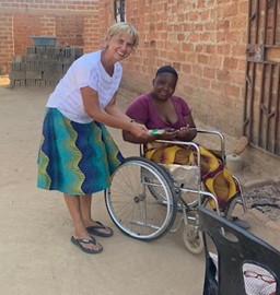 Grace receiving her new pair of scissors