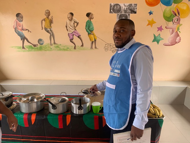 Nutritional nurse, James, with food ready to educate parents on__ nutrional feeding