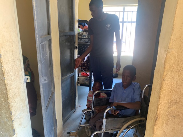 Able bodied Choongo students assist the disabled students
