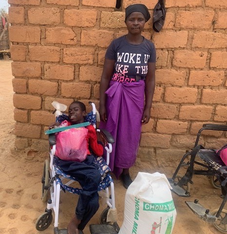 Cabilo with his mother and supplies