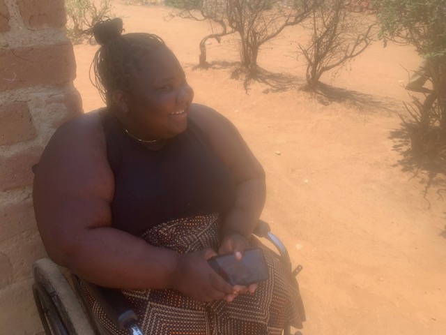 Grace seeing the HHZ vehicle approaching with the mobilty cart.__