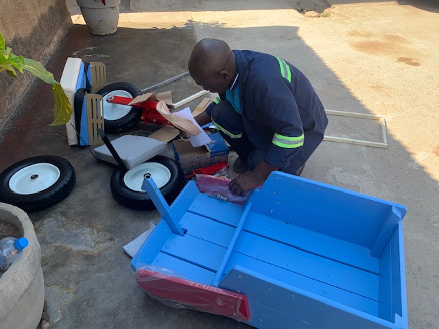 Grace's cart being assembled by Robbie