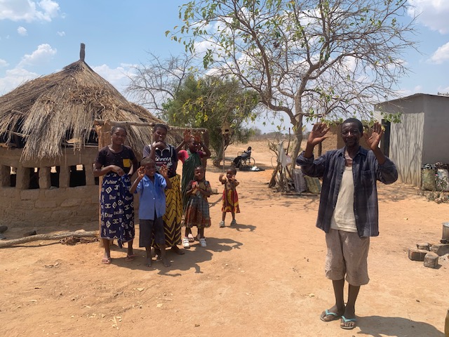 Kazolo's family .. Kazolo in the background.