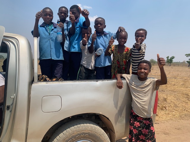 Primary school children who helped push Hilux